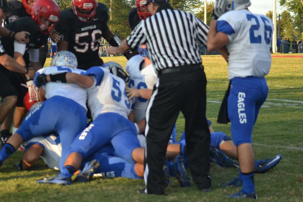 PILE ON-- The Eagles fight hard, but come up short against Mayfield at Saturdays Battle of the Birds.