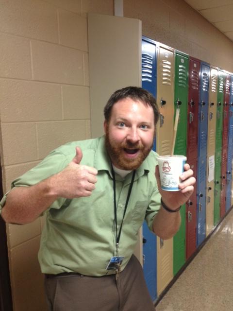 SWEET SHAKE-- English teacher Mark Mallory enjoys his reward for high teacher attendance.