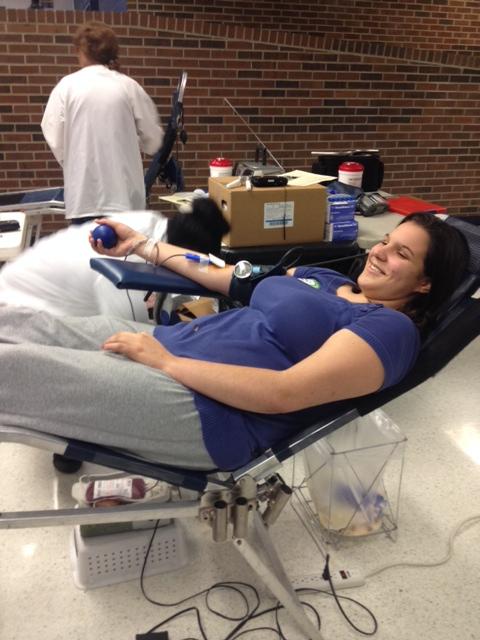 GIVING THE GIFT OF LIFE-- Senior Kaelyn Talbot is all smiles as she donates a pint of blood at GCs Red Cross Blood Drive.
