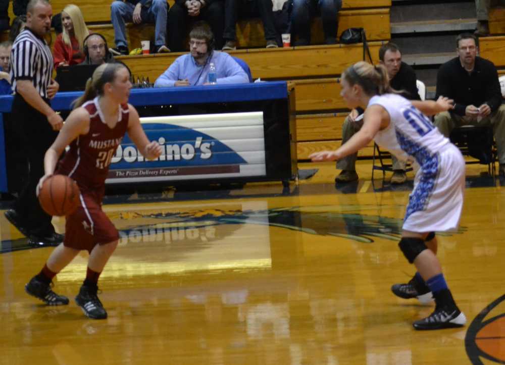 HOLDING DOWN THE STAMPEDE-- Junior Gracie Martin defends against a McCracken County player late in the third quarter 