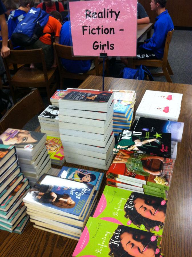 WE READ-- GCHS library prepares for next weeks event.