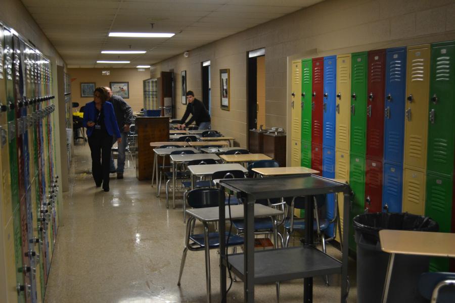 CLEAN-UP UNDERWAY-- GCSD Superintendent Kim Harrison surveys the damage as custodians and students work to empty rooms after this mornings pipe burst.