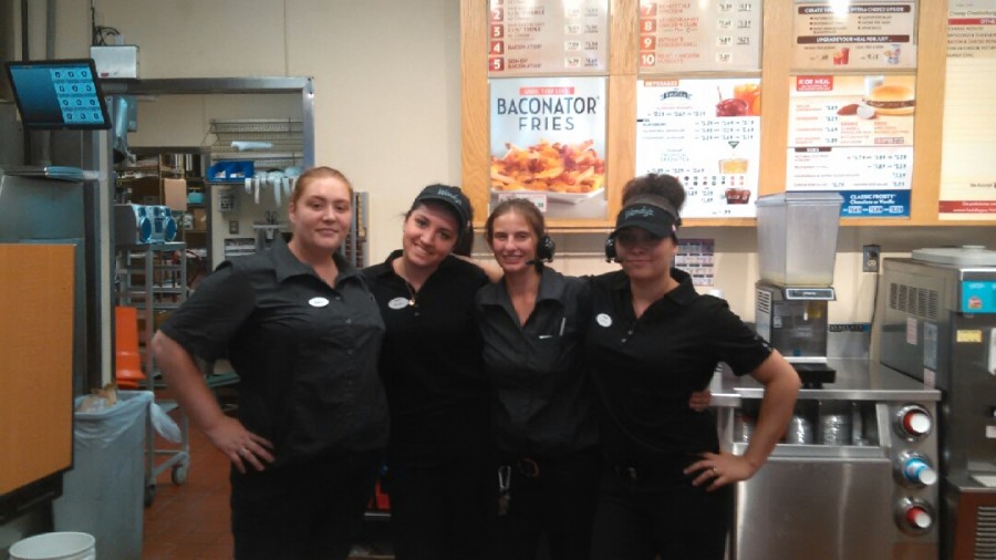 ALL SMILES HERE-- Workers Mallory, Megan, Amber, and Joyce pose in their work station.