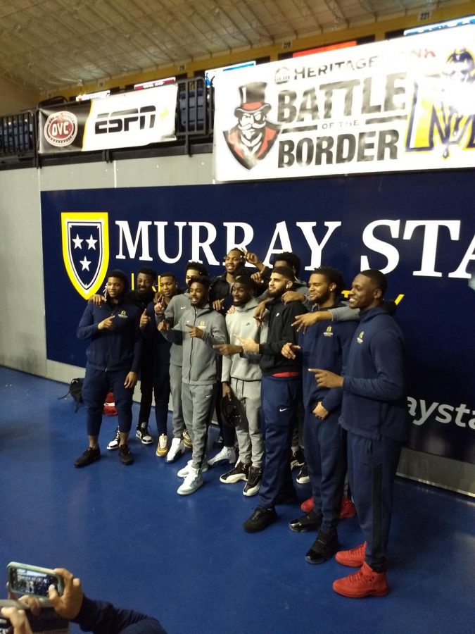 The Racers take one last picture in the CFSB Center.