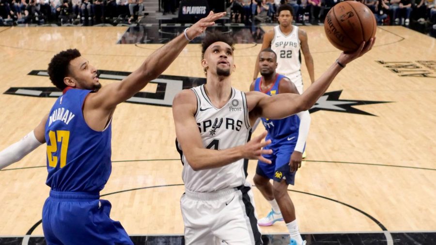 Derrick White attempts a layup against the Denver Nuggets- USA Today