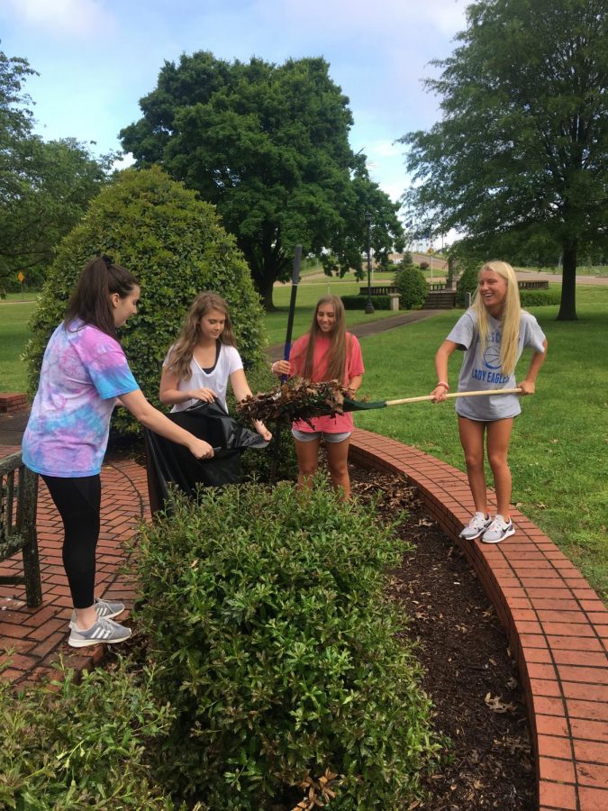 GCHS Juniors Abby Seavers, Belle Parham, Emilee Chamness, and Shelby Gargus help landscape Harmon Park. 