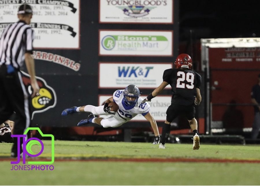 Clint McKee with an iron grip touchdown. Photo courtesy of Jones Photography.