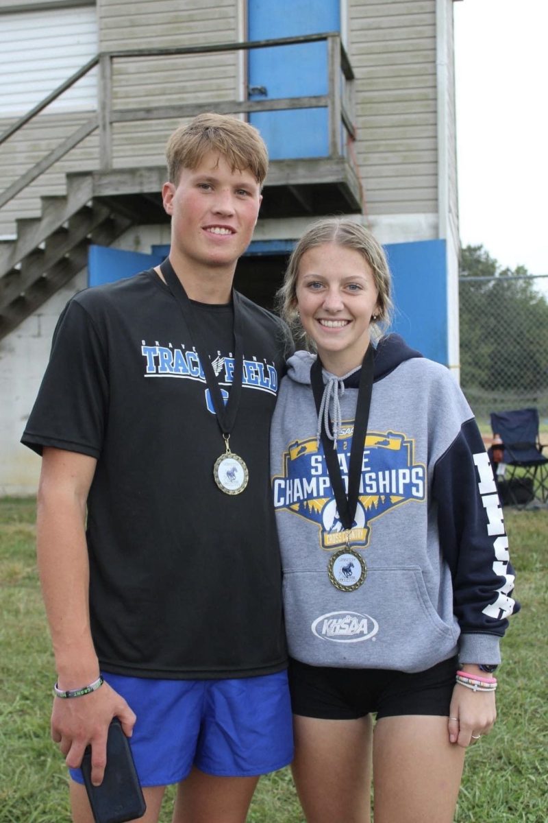 Seniors Tray Madding and Emma Madding set GCHS Cross-Country records at Mustang Stampede