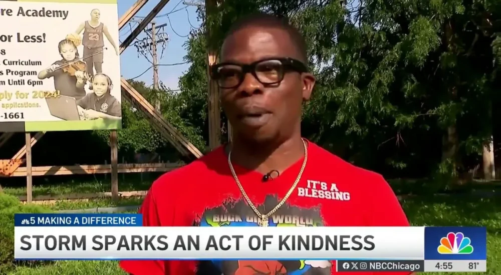 A Chicago man helps a mother and her children find shelter during a storm