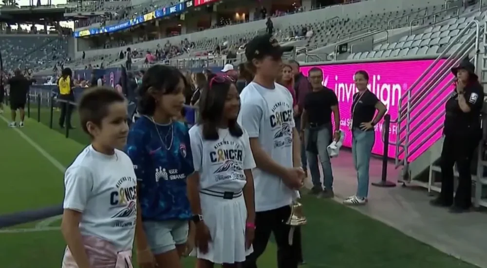 San Diego Wave FC players and families at a match during a VIP cancer support experience