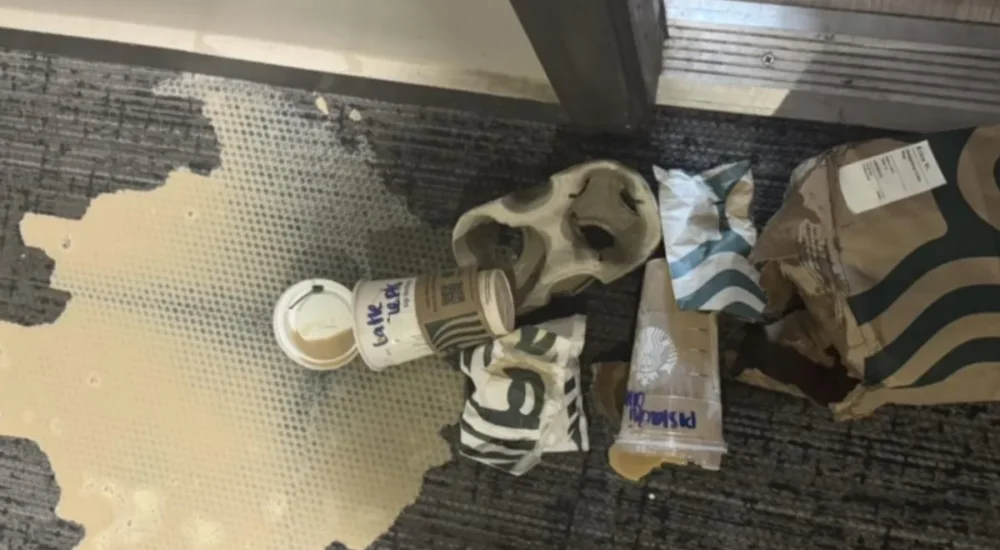 A locked gun safe beside a family home during a divorce dispute over firearms