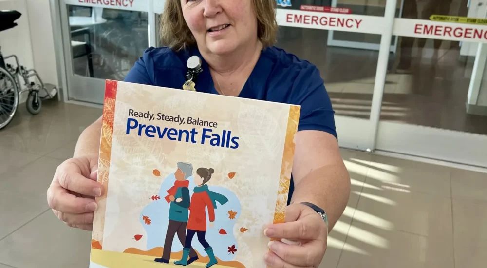 A hospital nurse discussing fall prevention tips for older adults