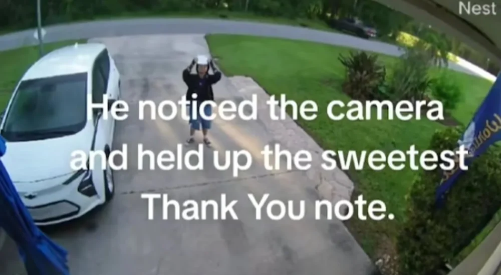 A woman and her husband sneak into a kitchen for late-night leftovers as a dog watches