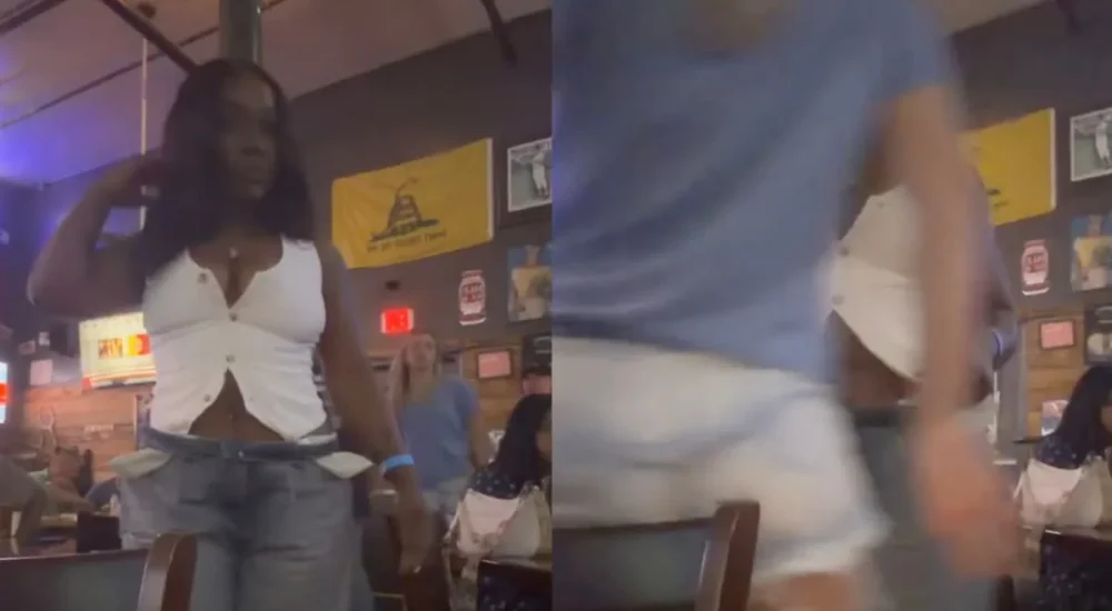 A Houston Little Caesars cashier stands at a crowded counter during a busy lunch rush