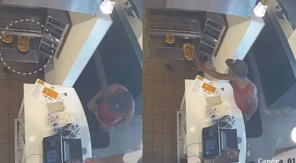 Carolyn Milano of La Spiga Bakery speaking in a TikTok video while holding a pizza