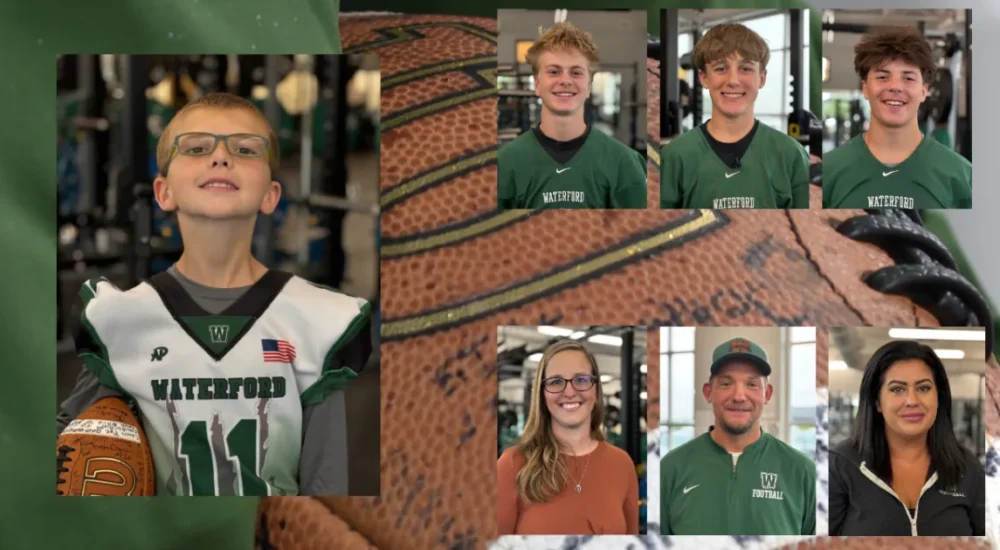 Aiden Dahl wearing a football jersey with teammates in Waterford, Wisconsin
